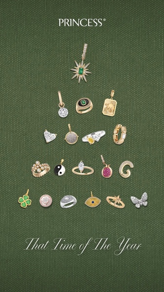 A festive flat-lay display of assorted gold and gemstone jewelry pieces arranged in the iconic silhouette of a Christmas tree against a textured green background.