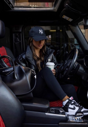 This creative showcases a premium, lifestyle-focused aesthetic, positioning the puffer jacket as a staple in an aspirational, fast-paced daily routine.