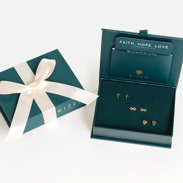 A top-down view showing a jewelry box branded as Rizen with three pairs of earrings displayed on a dark green velvet insert.