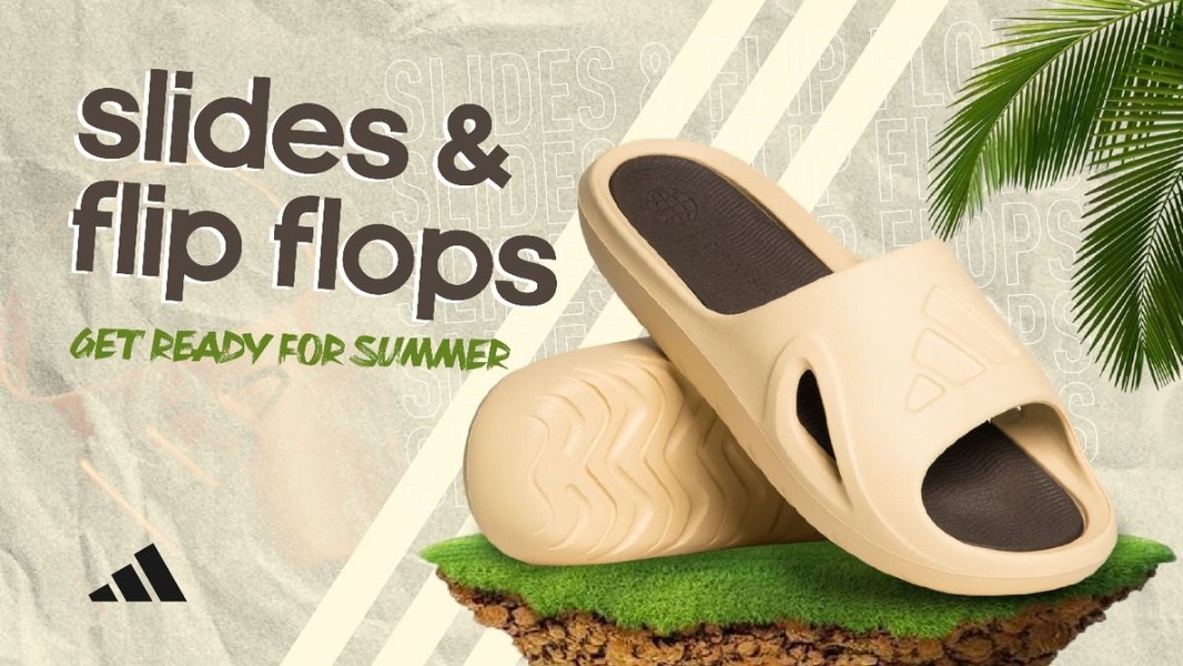 A high-contrast product hero creative featuring slides resting on a small grass platform against a textured, earthy background.