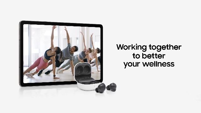 A clean, lifestyle-oriented ad showing wireless earbuds alongside a tablet displaying a yoga class.