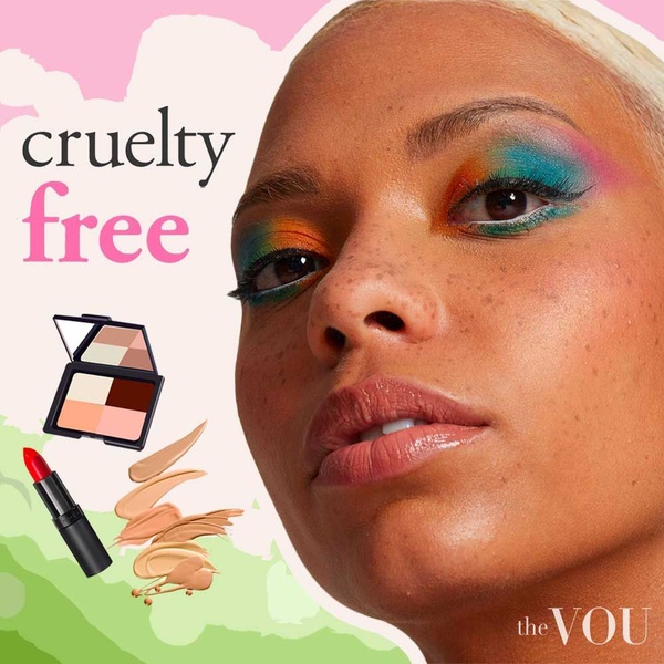 A close-up portrait of a model with artistic eye makeup featuring a cosmetic palette and lipstick, highlighting a clean beauty value proposition.