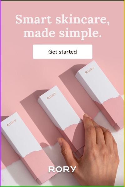 A top-down view of three elegant, color-coordinated skincare product boxes on a soft pastel background, with a hand reaching toward one, emphasizing simplicity and premium aesthetic.