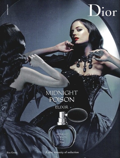 This advertisement uses a high-contrast mirror reflection of a model to create a mysterious and seductive mood for a fragrance product.