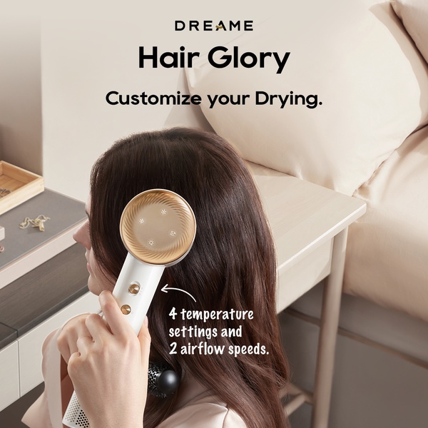 A close-up, high-quality shot of a consumer holding a hair dryer, with clear text overlays pointing out its temperature and airflow settings.