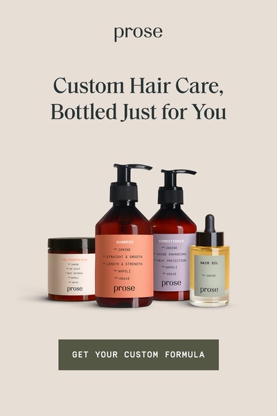 A minimalist, high-contrast studio shot featuring a full regimen of custom hair care products, including shampoo, conditioner, a mask, and oil.