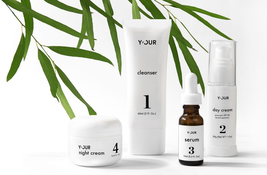 This creative displays a full four-step skincare set in a bright, clean, studio-lit environment, emphasizing order and simplicity.