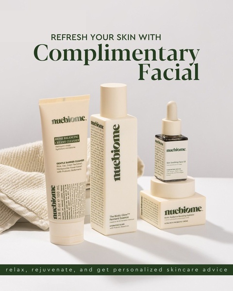 A high-quality studio shot of a skincare regimen centered around a complimentary facial offer, using a minimalist and clean aesthetic.