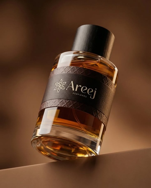 A high-end, studio-lit photograph of a perfume bottle against a warm brown background, emphasizing luxury and simplicity.