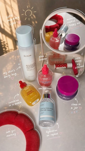 A soft-focus, overhead flat-lay shot of various skincare bottles annotated with handwritten-style labels to emphasize a curated morning routine.