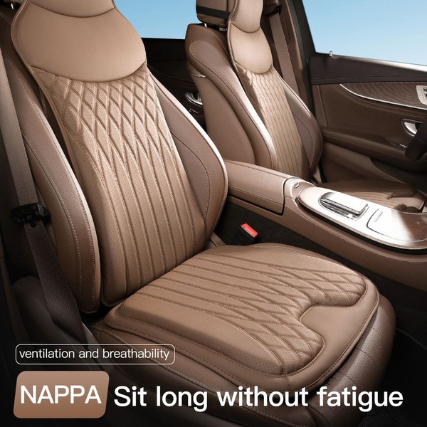 A high-quality close-up of premium Nappa leather car seat cushions showcasing the quilted texture and focus on long-distance comfort.
