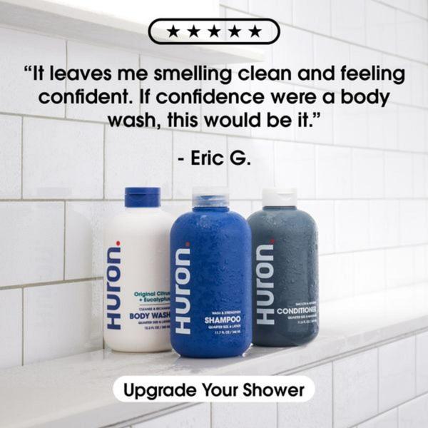 A minimalist, square-ratio product display featuring a customer review set against a clean, tiled bathroom background.