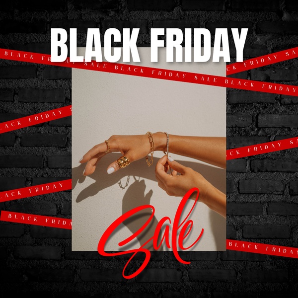 A high-contrast visual featuring stacked gold jewelry on a hand against a dark brick background, utilizing red ribbons to emphasize a Black Friday sale.