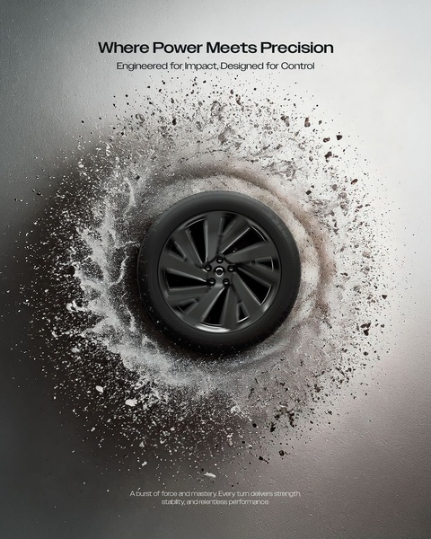 A high-impact, centered shot of a tire surrounded by a spray of earth and water to highlight grip and stability.