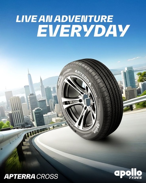 A high-impact, aspirational image of a vehicle tire centered against a city skyline, emphasizing freedom and movement.
