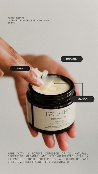 A close-up, high-quality shot of a body balm with annotated lines highlighting key natural ingredients.