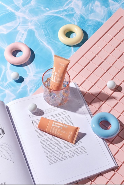 skincare cream, face cream, moisturizer, beauty cream, facial treatment, skincare product, cosmetic cream, product launch, flat lay, fresh, playful, blue, pink, orange