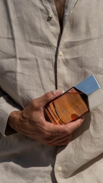 cologne, fragrance, perfume, eau de toilette, aftershave, product launch, lifestyle, luxurious, warm, neutral, orange