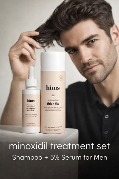 A high-end, clean studio shot featuring a man highlighting his hair alongside the shampoo and serum treatment set, maintaining a premium professional aesthetic.