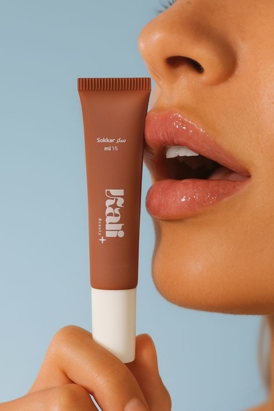 lip gloss, lip tint, lip color, lip product, liquid lipstick, lip makeup, tinted lip balm, product launch, minimalist, fresh, warm, brown, blue