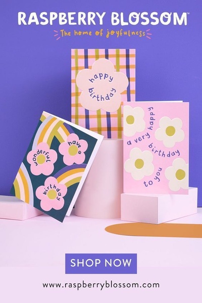 A clean, studio-lit hero shot featuring three distinct greeting card designs on minimalist pedestals, emphasizing color and pattern.