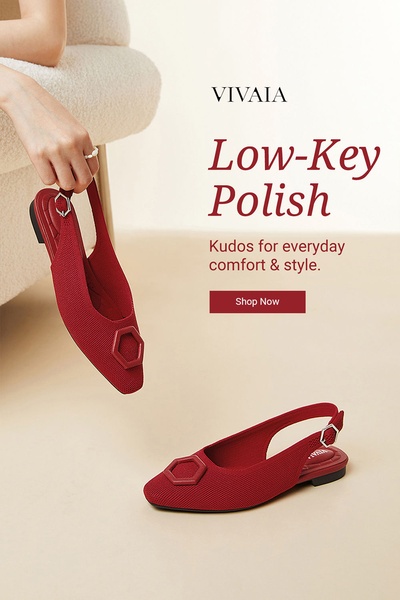 A minimalist, high-end display featuring red slingback flats held by a model, set against a clean, neutral background to emphasize simplicity.