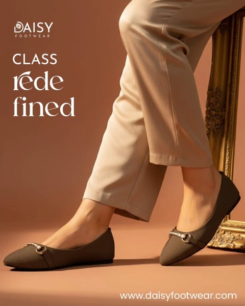 This ad features a clean, studio-lit image of women's flats paired with neutral trousers to emphasize a sophisticated and versatile aesthetic.