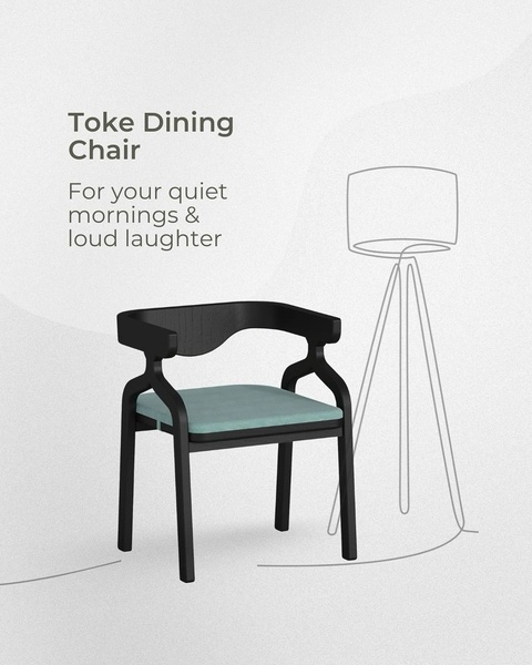A minimalist advertisement featuring a single dining chair with a soft blue cushion, using a clean background and line-art lamp graphic to emphasize simplicity.