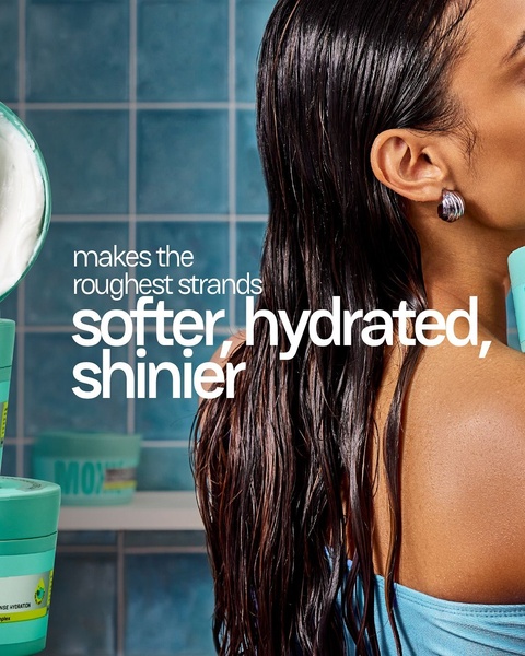 A close-up shot of a hair mask product application with bold typography emphasizing immediate hair health results.