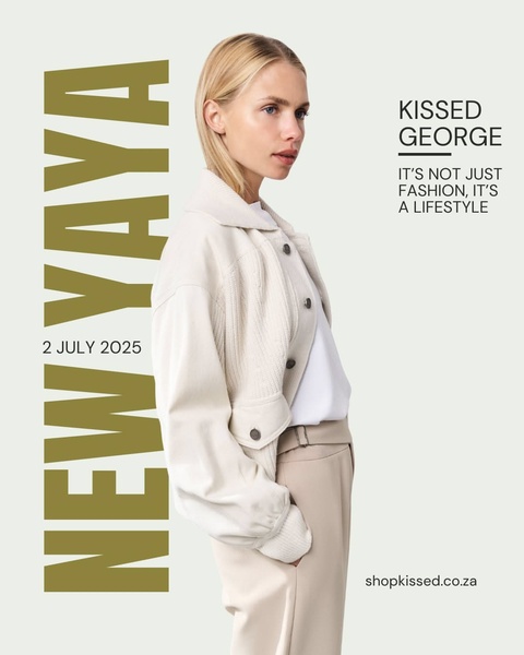 A high-fashion, minimalist portrait showcasing a jacket paired with neutral-toned clothing in a clean, professional studio environment.
