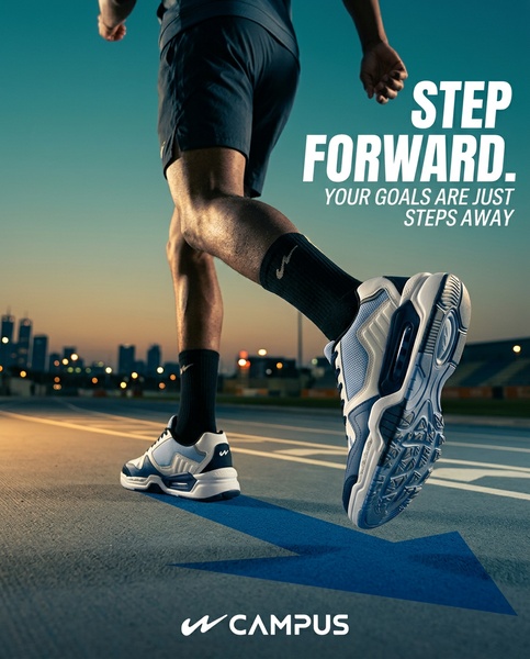 A close-up shot of a runner's legs and sneakers mid-stride on a track, featuring a graphic arrow leading toward the horizon.
