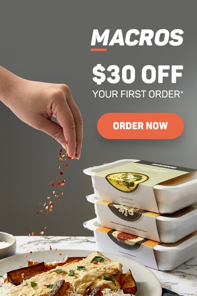 A top-down view of a meal kit package display with a human hand adding seasoning to a plated dish, accompanied by a clear $30 off incentive.
