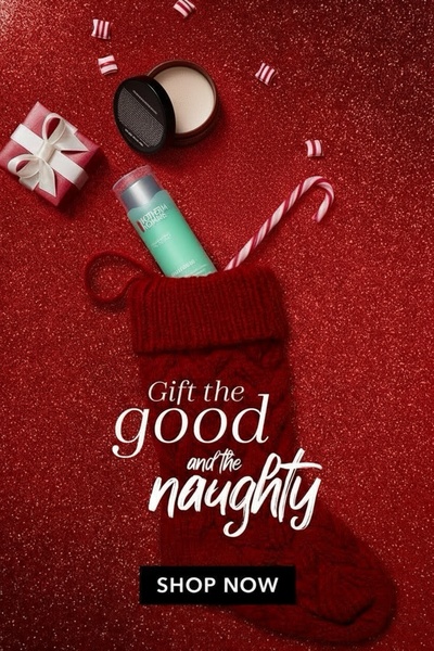 A festive, holiday-themed advertisement featuring a skincare serum bottle nestled in a Christmas stocking surrounded by candy canes and gift-wrapped items on a red glitter background.