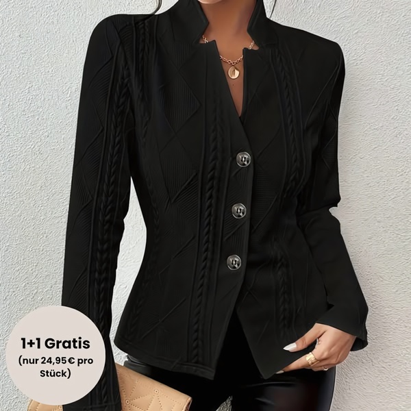 A high-contrast studio image featuring a woman wearing a structured black blazer with a clear 1+1 sales offer badge.
