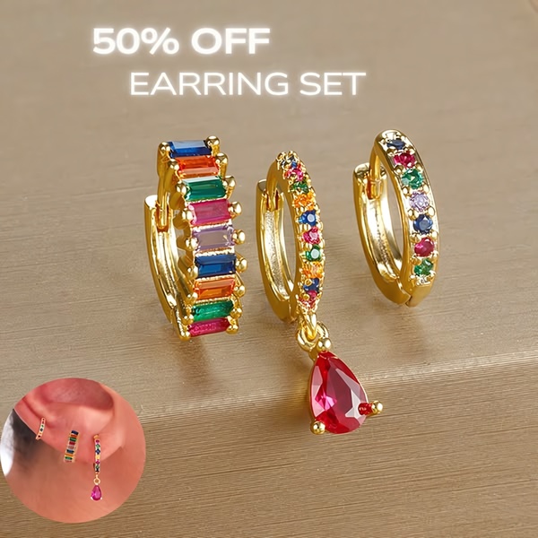 A close-up product display of a three-piece earring set featuring colorful gems and gold hoops, highlighting a 50% discount.