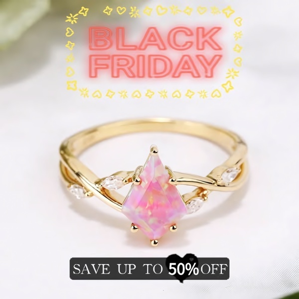 A close-up product shot of a gold ring with a pink kite-shaped opal, featuring a prominent Black Friday overlay.