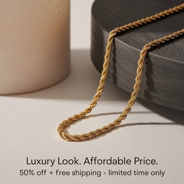 A high-end, clean product shot of a gold rope chain necklace resting on a dark circular pedestal, highlighting the product with soft, professional lighting.