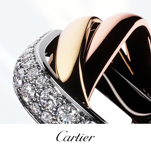 A close-up, high-detail macro shot of a three-band luxury ring featuring a diamond-encrusted band alongside rose and yellow gold finishes.