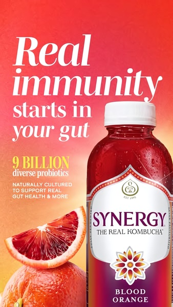 This ad features a high-impact product hero shot of a blood orange kombucha bottle paired with a clear, benefit-driven headline.