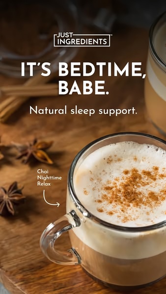 A warm, aesthetic shot of a glass mug filled with chai tea, sprinkled with spices, evoking a relaxing bedtime routine.