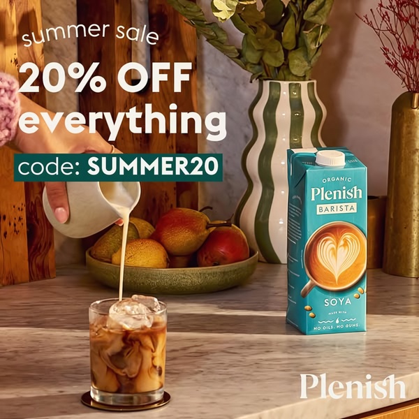 A high-quality lifestyle shot featuring a barista-style Soya Milk pour into an iced beverage, paired with a direct 20% off summer sale promotion.