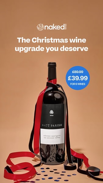 A festive product-focused ad featuring a premium bottle of Cabernet Sauvignon wrapped in holiday ribbon, highlighting a discounted bundle offer.