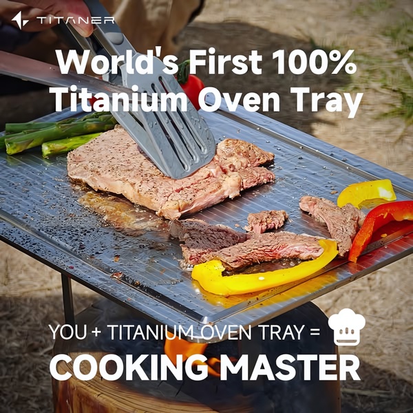 A square-format lifestyle ad featuring a Titanium Oven Tray in active use over a fire, emphasizing its status as the world's first.