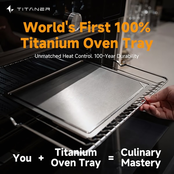 A high-contrast 1:1 image demonstrating a premium titanium oven tray being inserted into an oven, emphasizing durability and culinary precision.