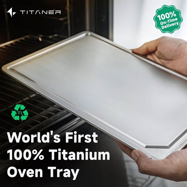 A static 1:1 image featuring a hand placing a premium titanium oven tray into an oven, highlighting the product's unique material and on-time delivery.