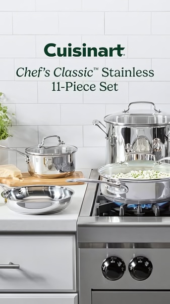 A clean, studio-lit hero shot of a stainless steel cookware set arranged on a kitchen counter, focusing on product quality and brand presentation.