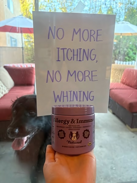 A straightforward, problem-solution pet supplement advertisement featuring a hand-written sign held behind a product jar to highlight user-centric benefits.