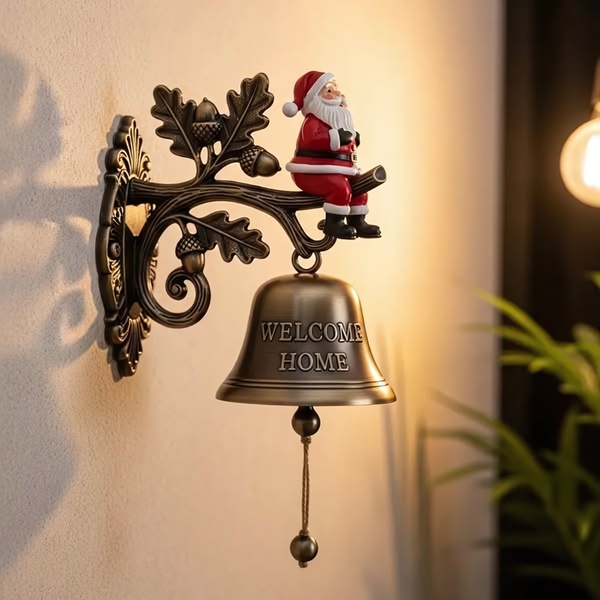 A close-up, high-quality product shot of a decorative wall-mounted bell featuring a Santa figurine, perfect for seasonal home decor marketing.