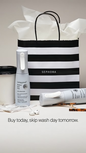 A clean, high-contrast, professional product shot of hair refresh mist bottles next to a branded shopping bag, emphasizing a simple benefit-driven headline.