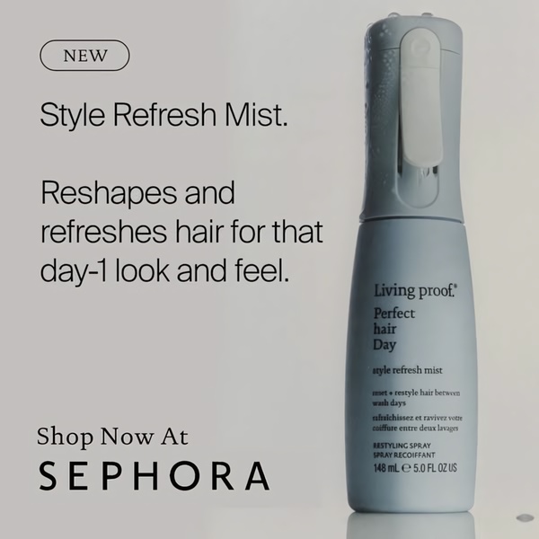 A clean, studio-lit, square format advertisement showcasing a hair styling mist bottle against a neutral background.